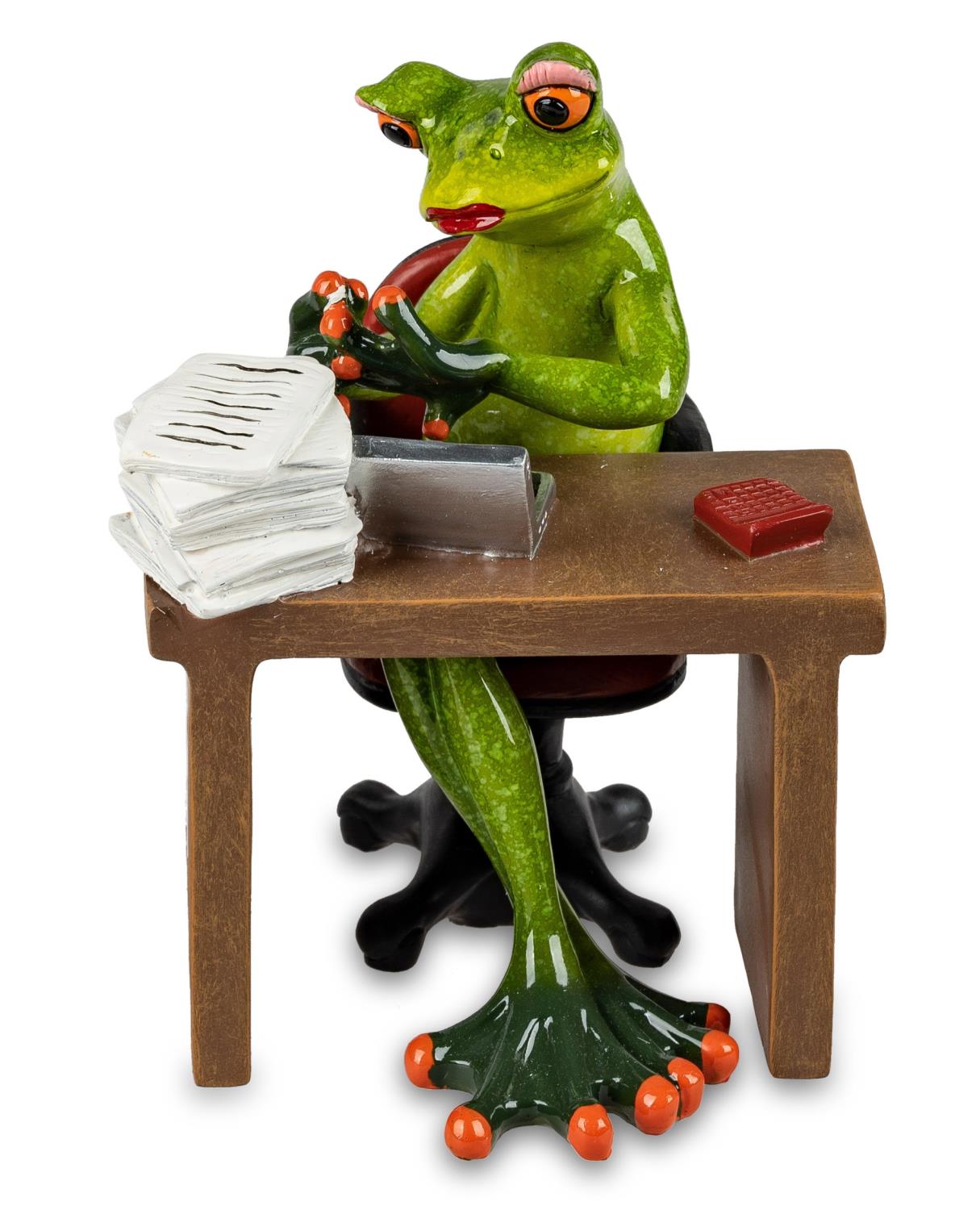 Eine grüne Froschfigur sitzt an einem Schreibtisch, tippt auf einer Schreibmaschine und hat einen St