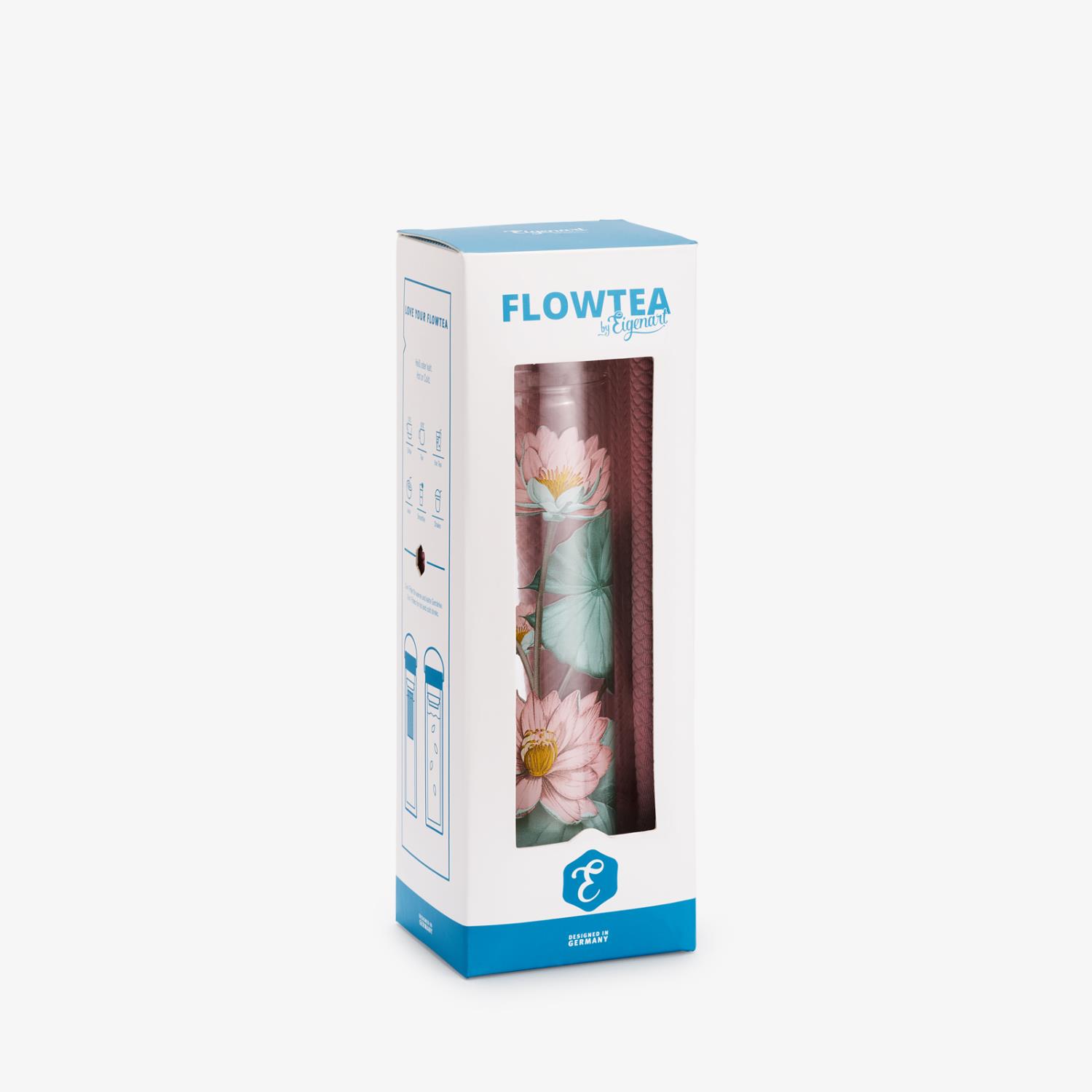 Verpackung eines Teebereiters mit floralem Design in Rosa und Grün, sichtbar durch eine transparente