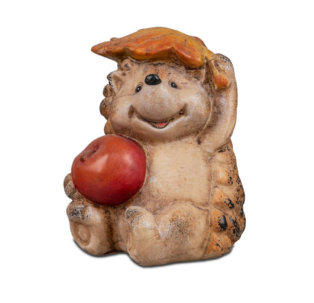 Ein lächelnder Igel mit einem roten Apfel in der Hand und einem Blatt als Schirm sitzt auf dem Boden.