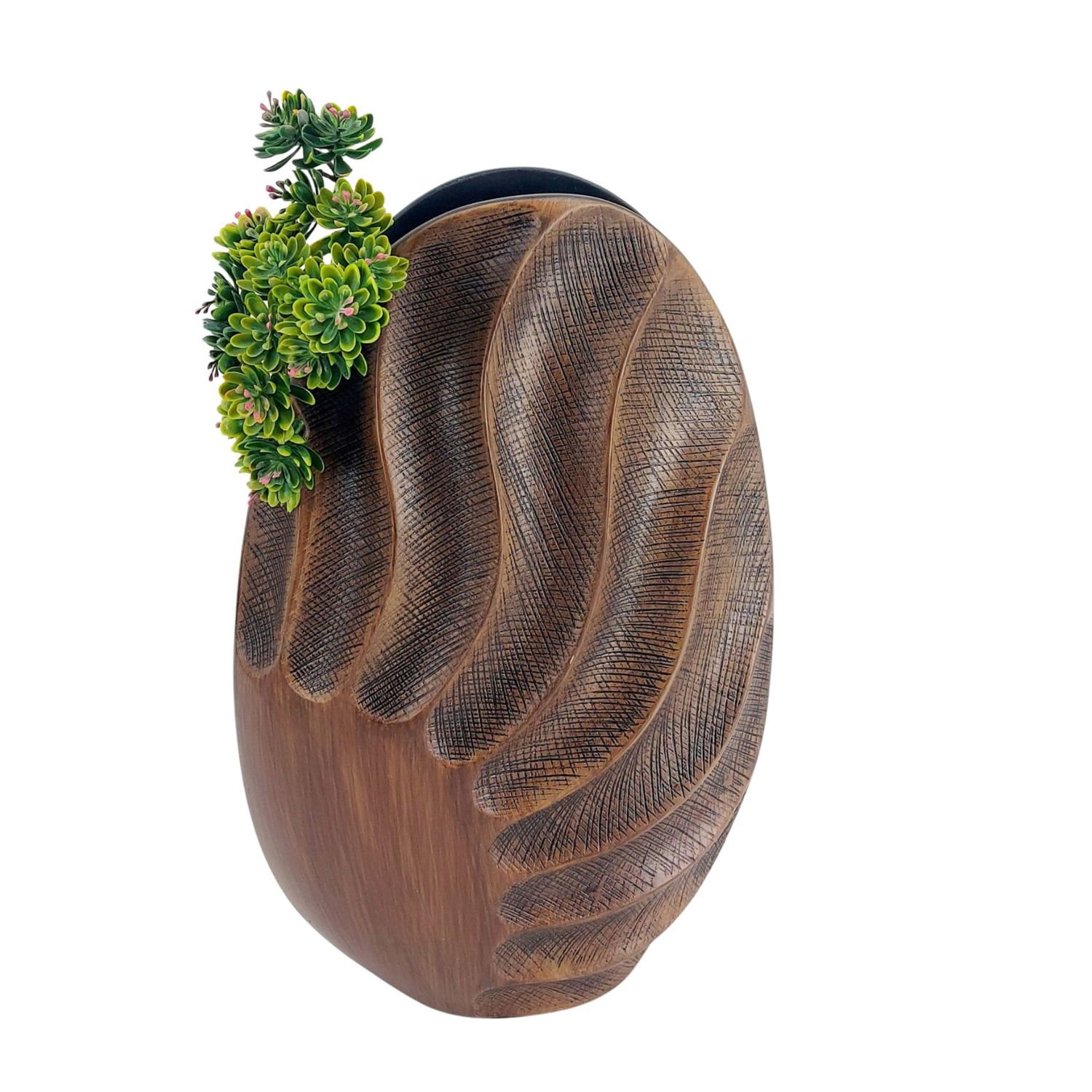 Vase in Form einer Hand mit grünen Pflanzen oben drauf