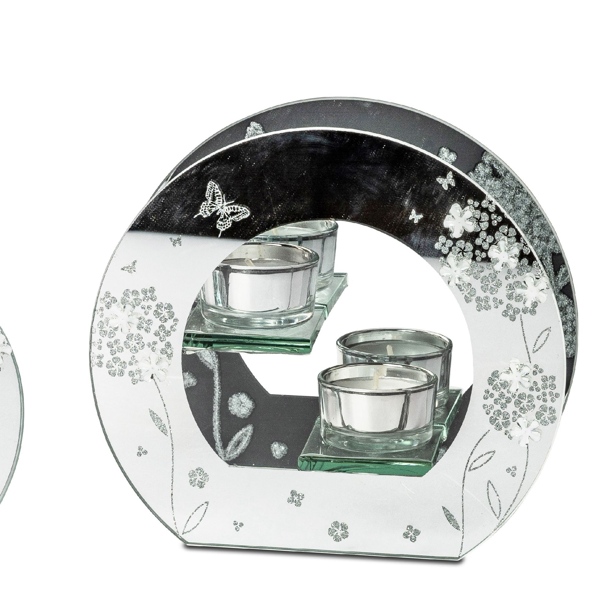 Dekorativer Kerzenhalter aus Spiegelglas mit drei Teelichtern und floralem Muster. Runde Form mit ei