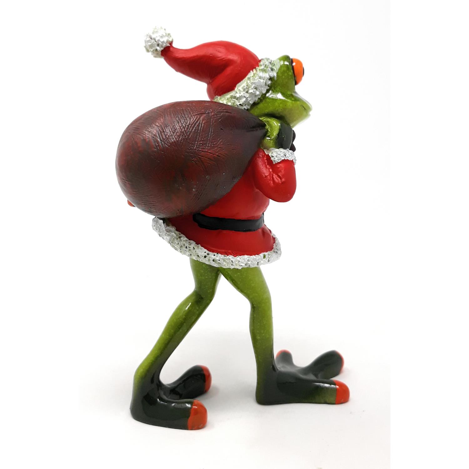 Eine grüne Figur in einem roten Weihnachtsmannkostüm trägt einen großen Sack auf dem Rücken. Sie hat