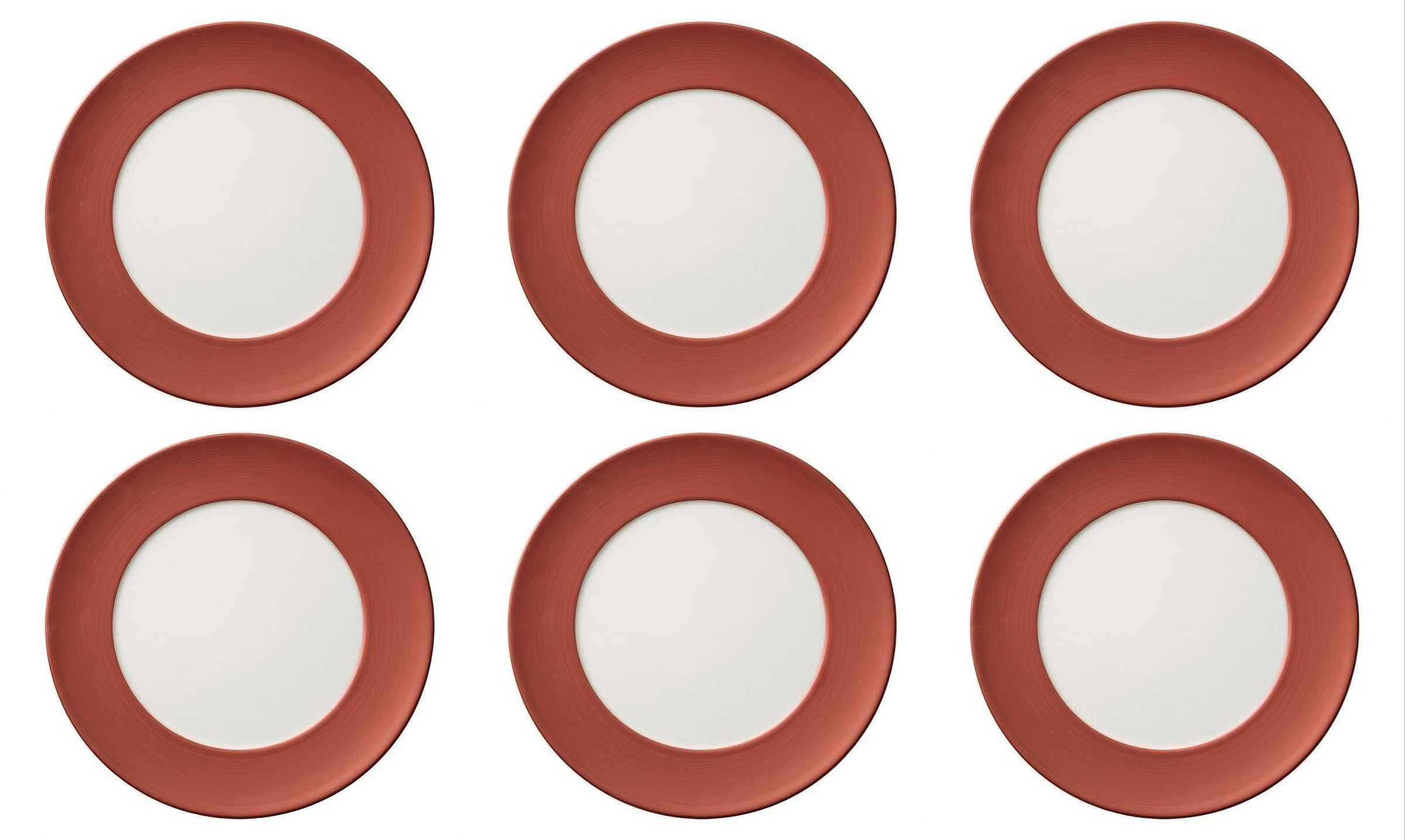 Sechs runde Teller mit rotem Rand und weißer Mitte, gleichmäßig angeordnet auf einem hellen Hintergrund.