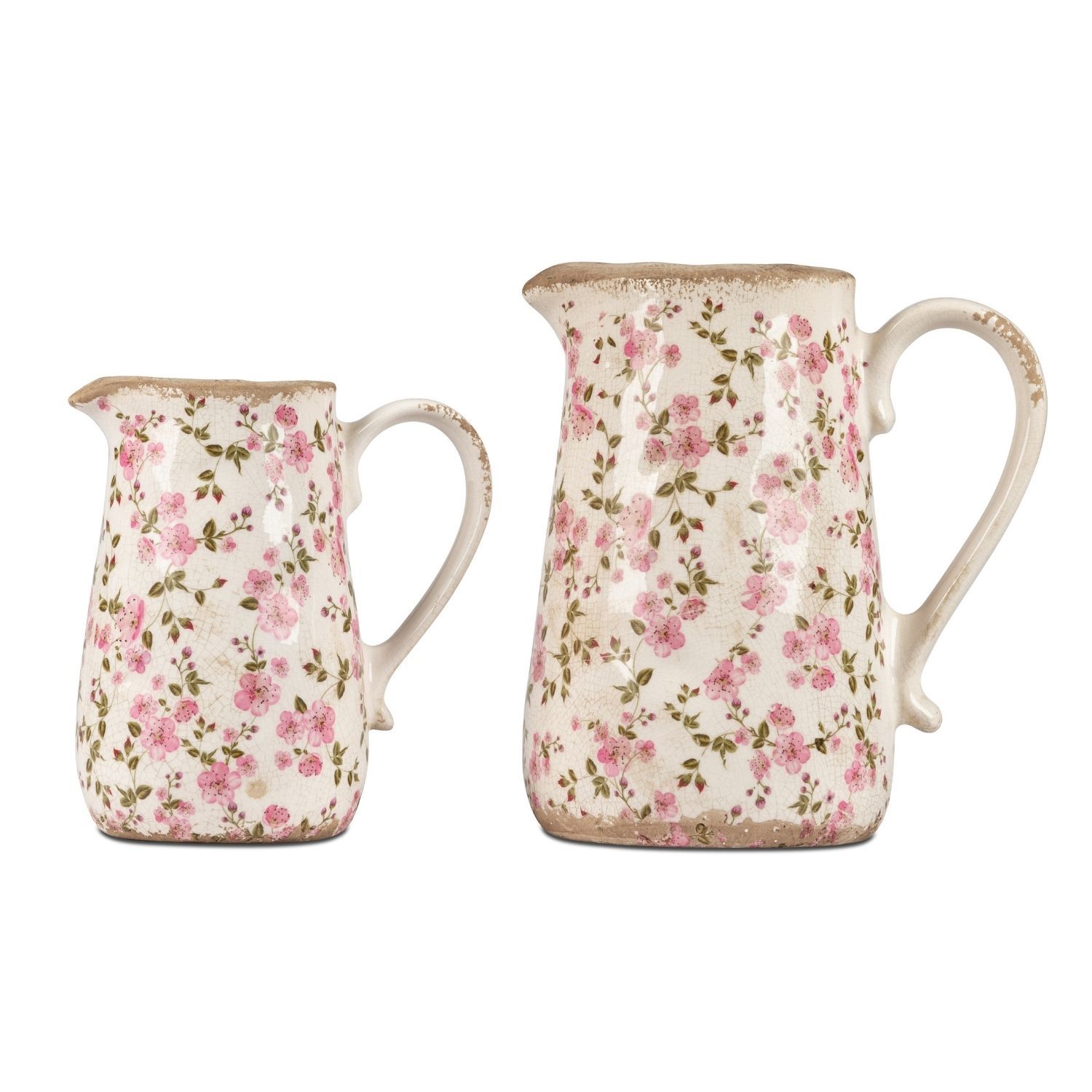 Zwei weiß verzierte Krüge mit rosa Blüten, ein kleiner und ein größerer
