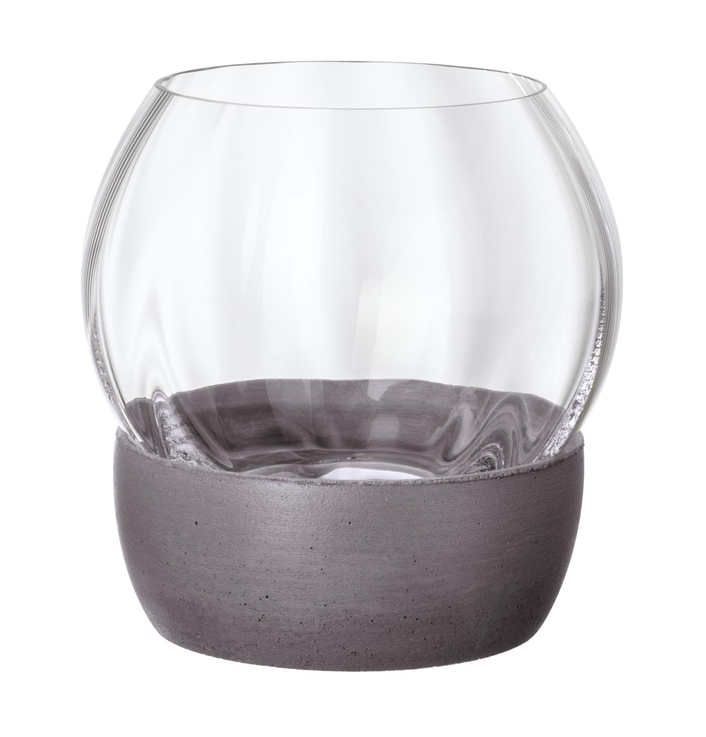 Ein transparenter Glasbehälter mit einer grauen, matten Betonbasis. Der obere Teil ist rund und leicht gewölbt.