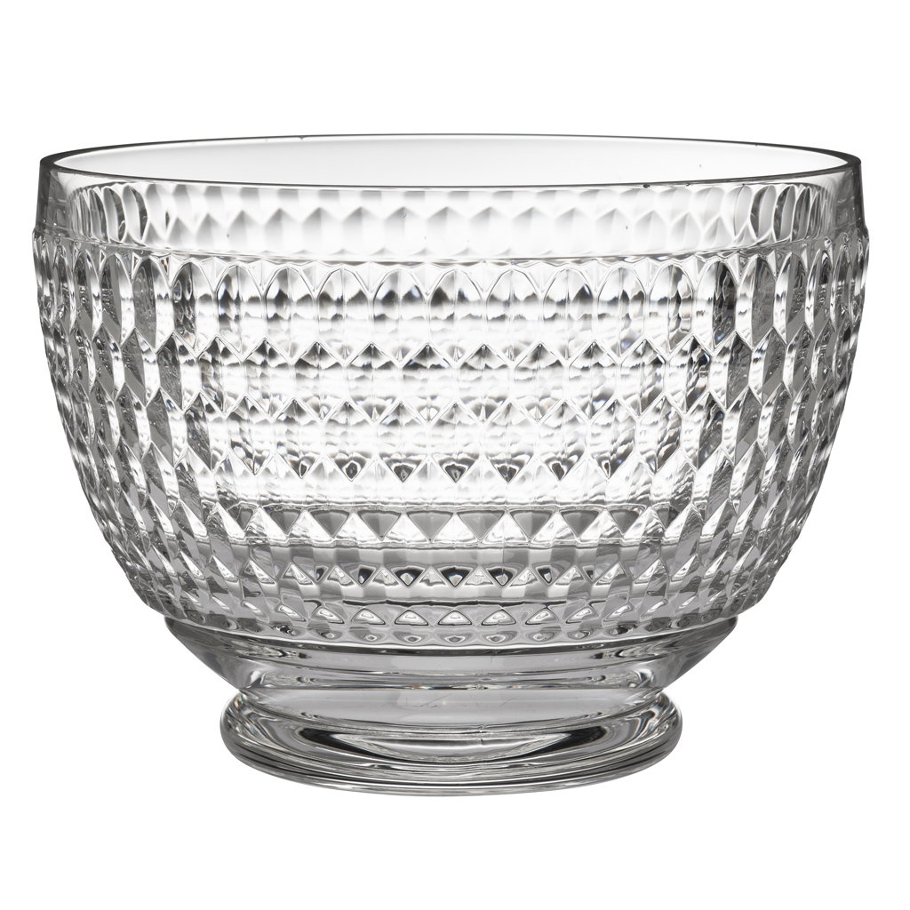 Klarglänzende Glasschüssel mit rautenförmigem Muster und breitem Rand, auf einem stabilen Fuß.