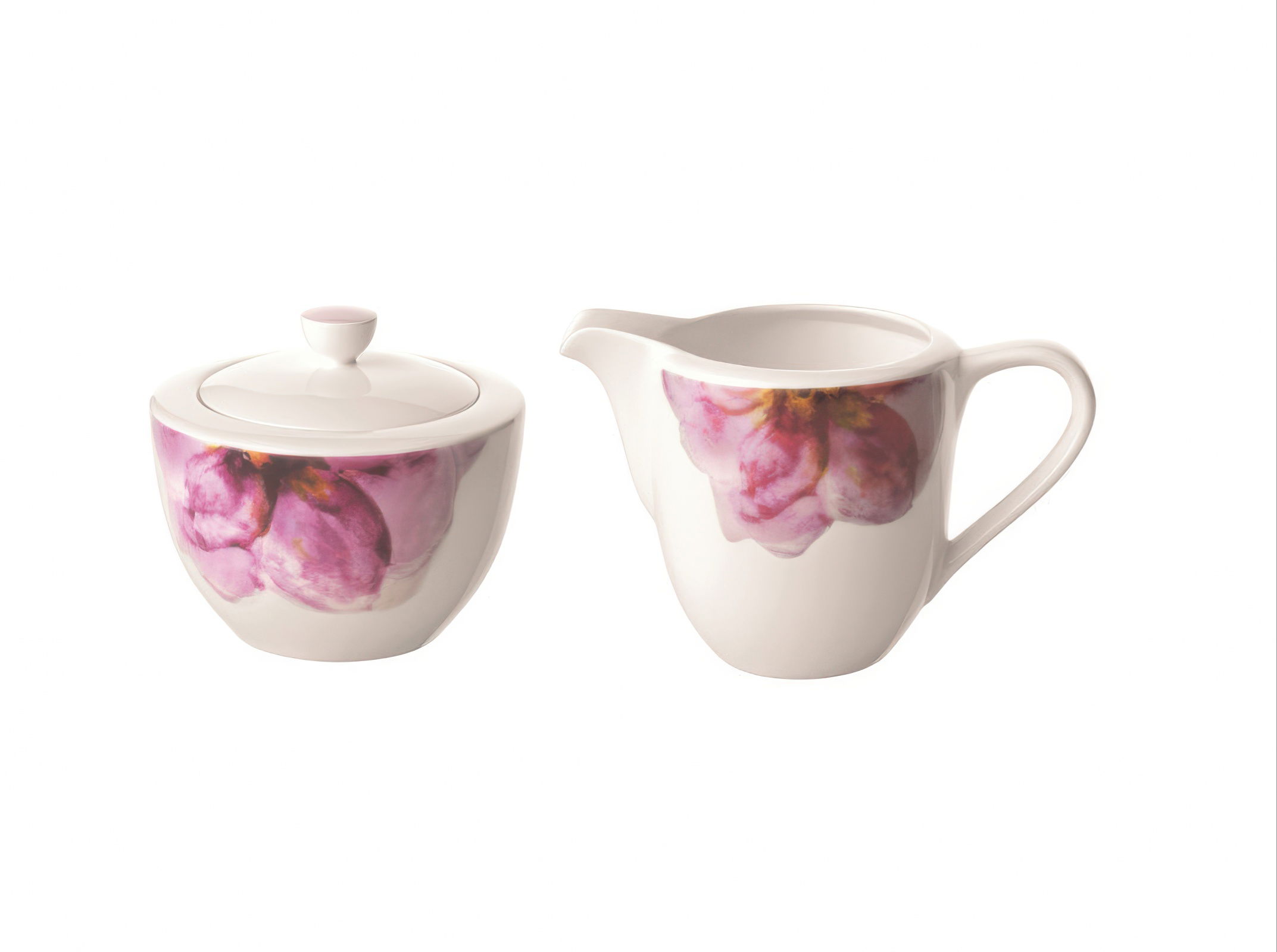 Zwei Porzellanbehälter: eine Zuckerdose mit Deckel und eine Kanne, beide mit pinken Blütenmotiven verziert.