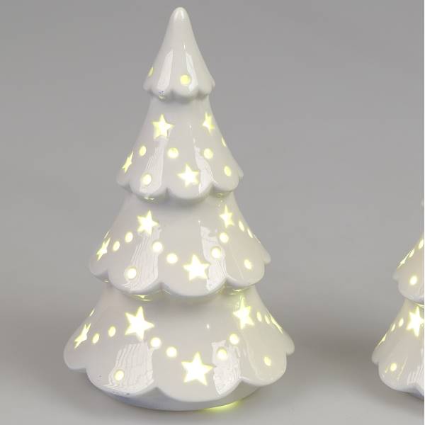 Weißer, glasierten Weihnachtsbaum aus Keramik mit leuchtenden Sternen und einer geschwungenen Form.