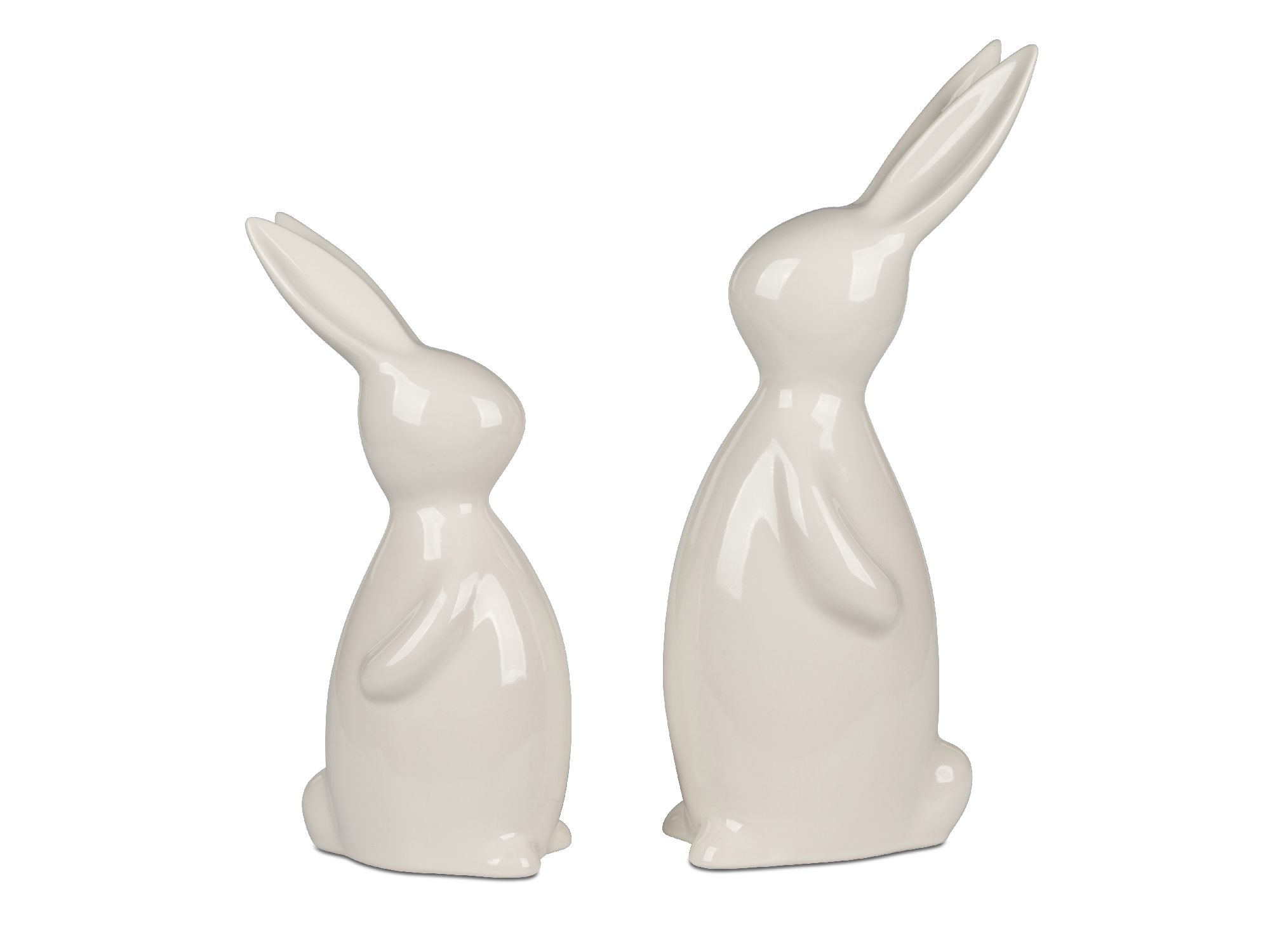 Zwei weiße, glänzende Keramikhasen in unterschiedlichen Größen stehen nebeneinander. Der größere Hase ist aufrecht, der kleinere sitzt.