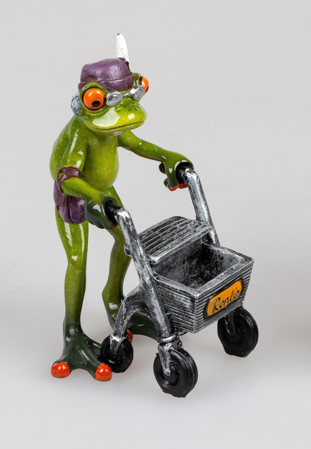Eine grüne Froschfigur mit Brille und Mütze schiebt einen silbernen Rollator mit einem schwarzen Kor
