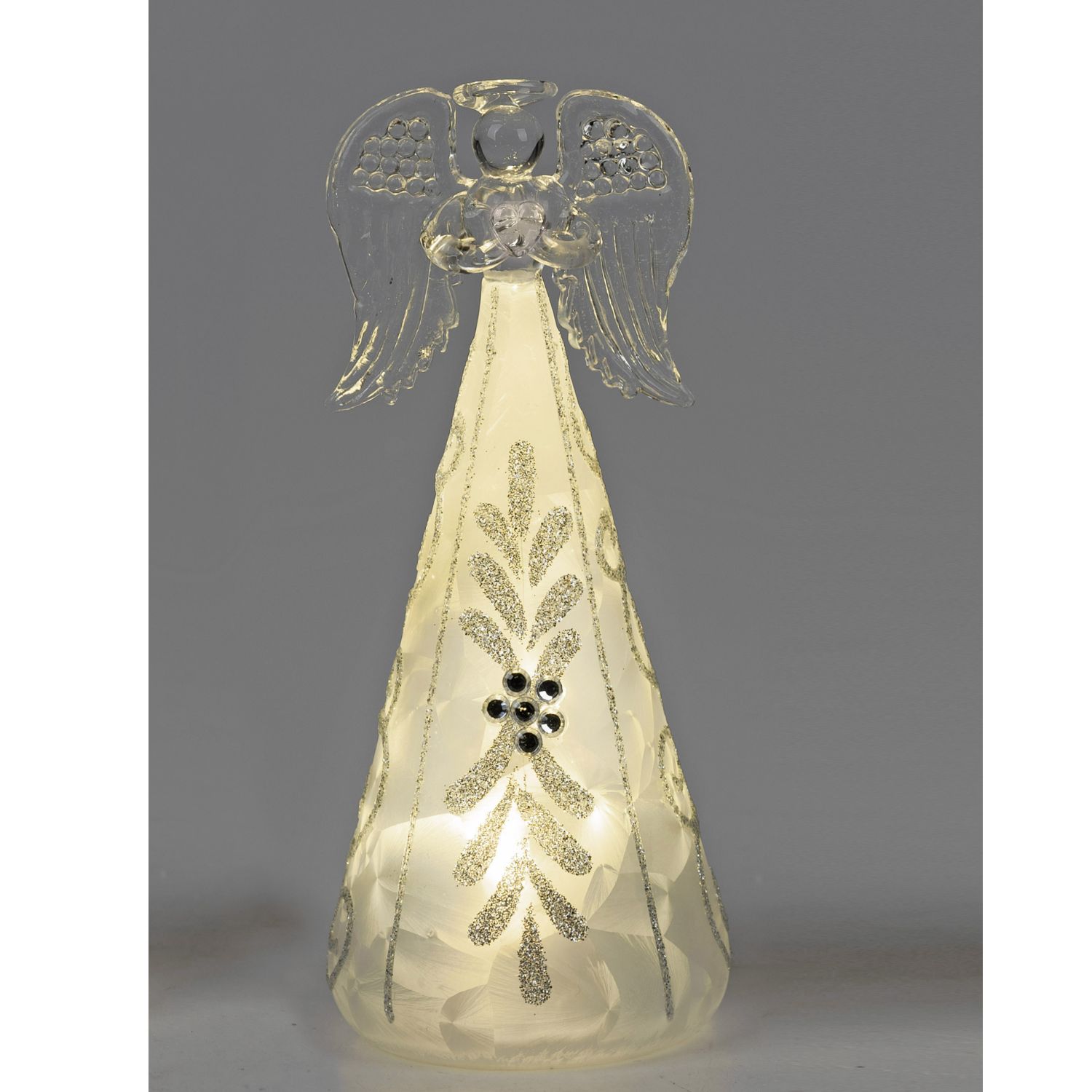 Leuchtende Glasfigur eines Engels mit Flügeln und glitzerndem Muster vor grauem Hintergrund