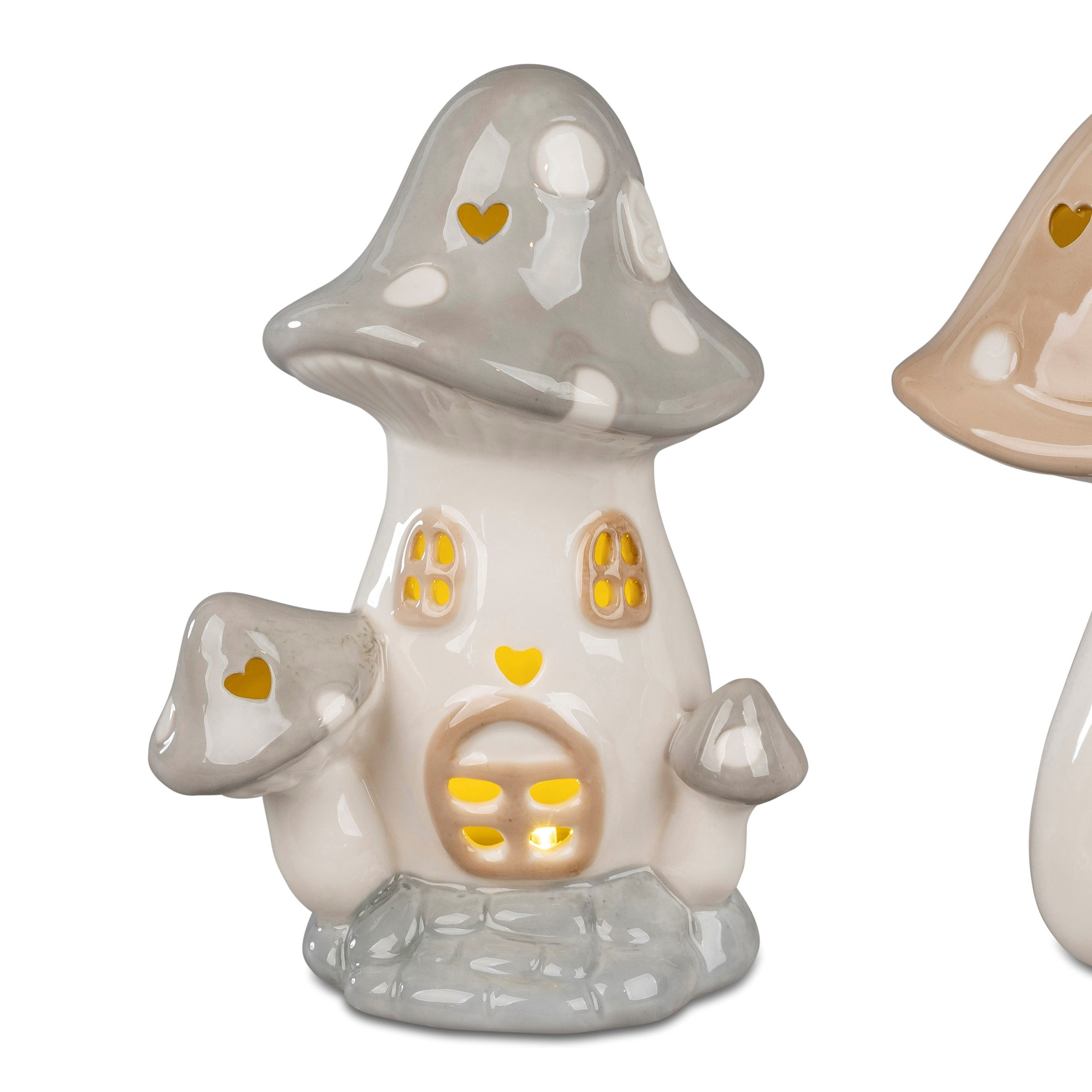 Keramische Pilzfigur mit grauem Hut, gelben Fenstern und Herzen, auf grauem Sockel. Rechts eine ähnliche Figur in Beige.