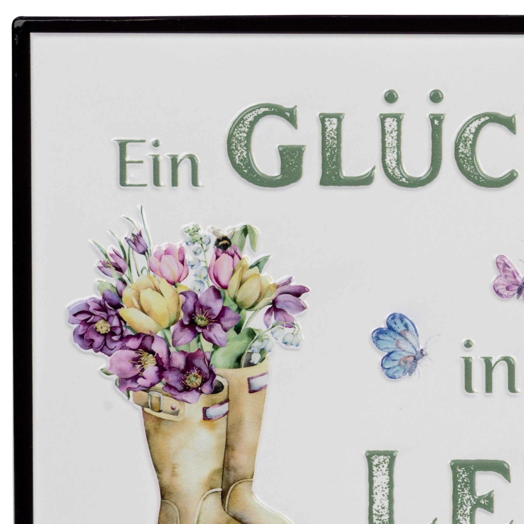 Ein Schild mit der Aufschrift „Ein Glück in LE“ und einer Illustration von Blumen in Gummistiefeln. Schmetterlinge sind ebenfalls abgebildet.